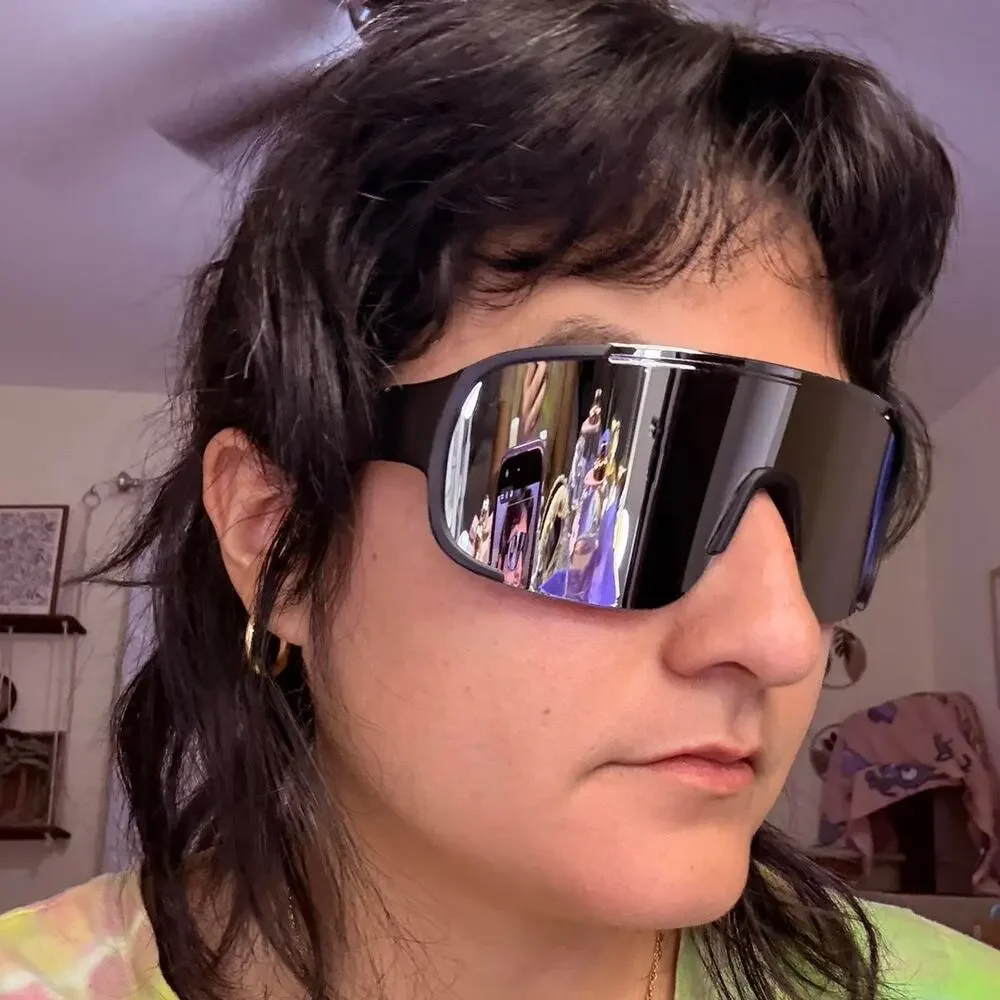 Unisex Black mirrored shield sunglasses with a sleek futuristic wraparound fit